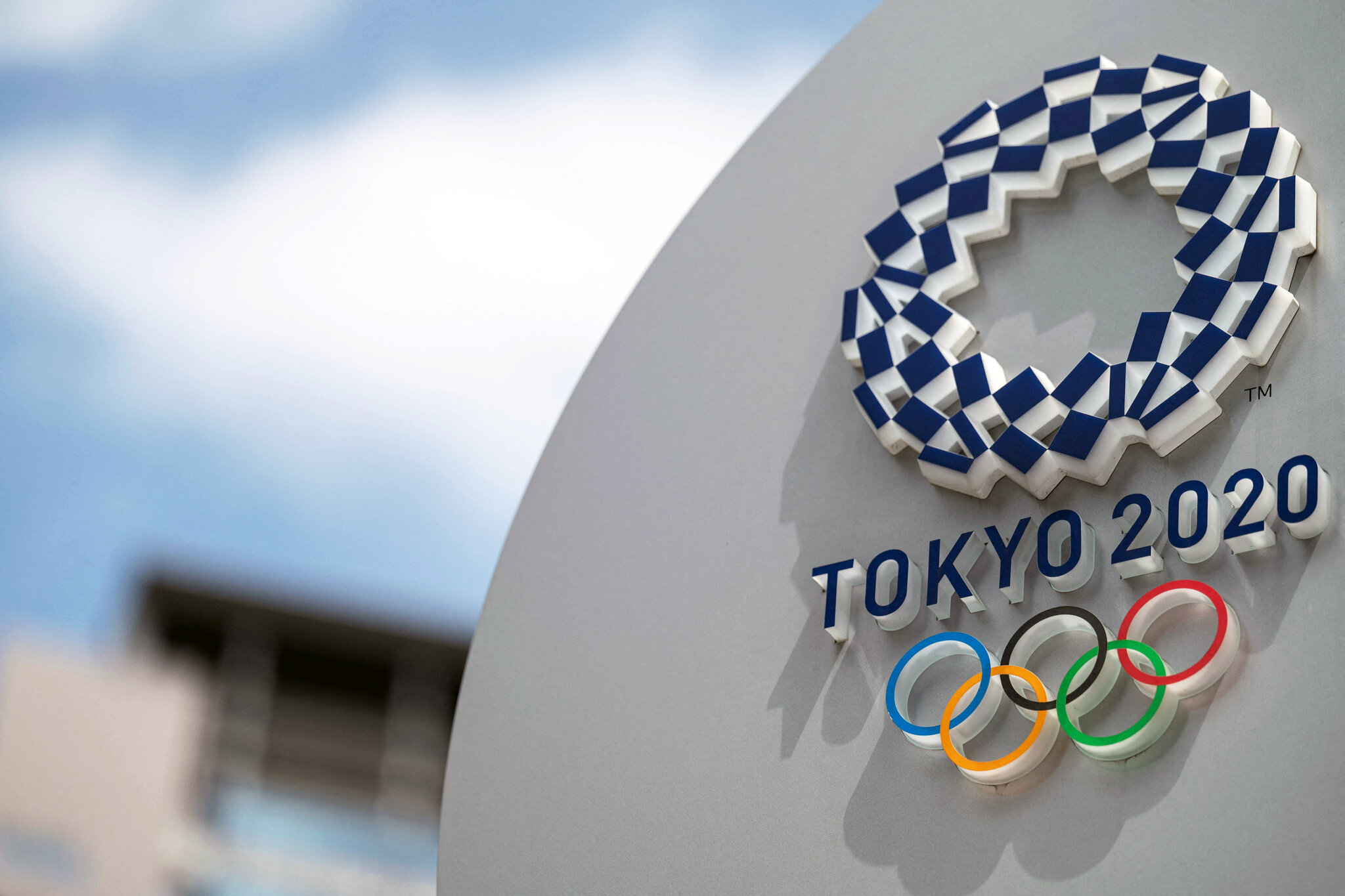 Japan PM warns of closed-door Olympics as virus cases rise