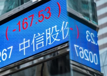 Asian shares rise as US Federal Reserve strikes less hawkish tone