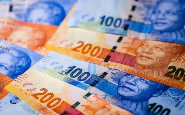 Rand Gains Ground as Dollar Buckles Under Trade Strain