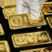 Gold steadies, equities recover as Australian rate hike lifts currency