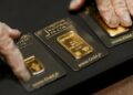 Gold tumbles to two month low as Iran conflict lifts dollar and oil