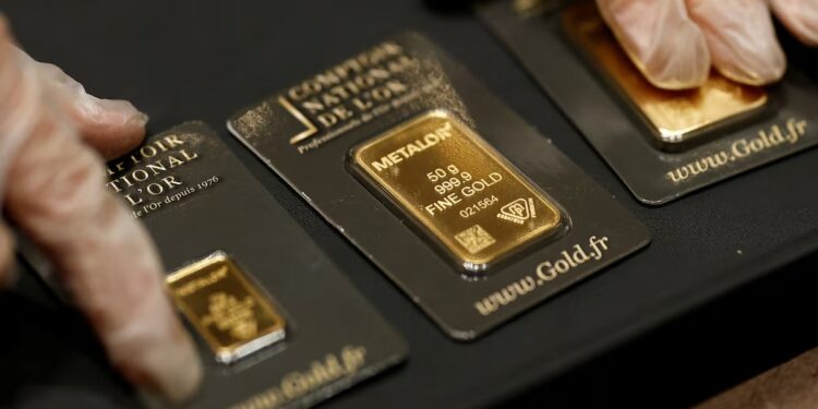 Gold tumbles to two month low as Iran conflict lifts dollar and oil