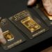 Gold tumbles to two month low as Iran conflict lifts dollar and oil